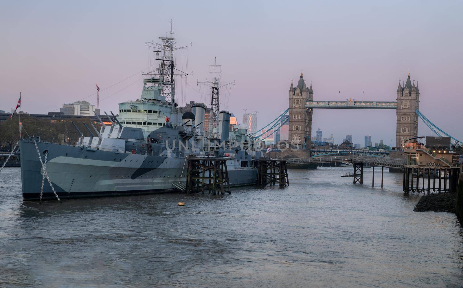 London, England - Apr 20, 2019 : HMS Belfast is a Town-class light cruiser that was built for the Royal Navy. She is now permanently moored as a museum ship in front of Tower Bridge on the River Thames, No focus, specifically.