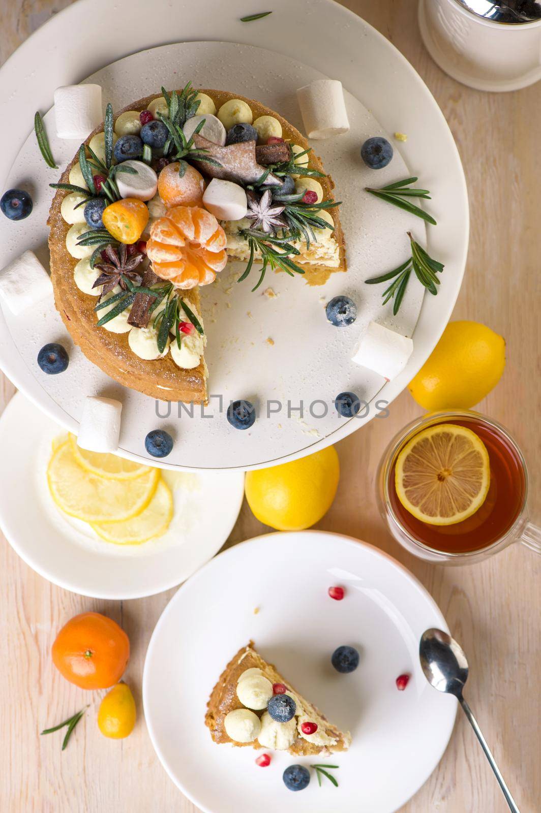 Honey cake pieces on a plate with lemon tea for dessert by aprilphoto