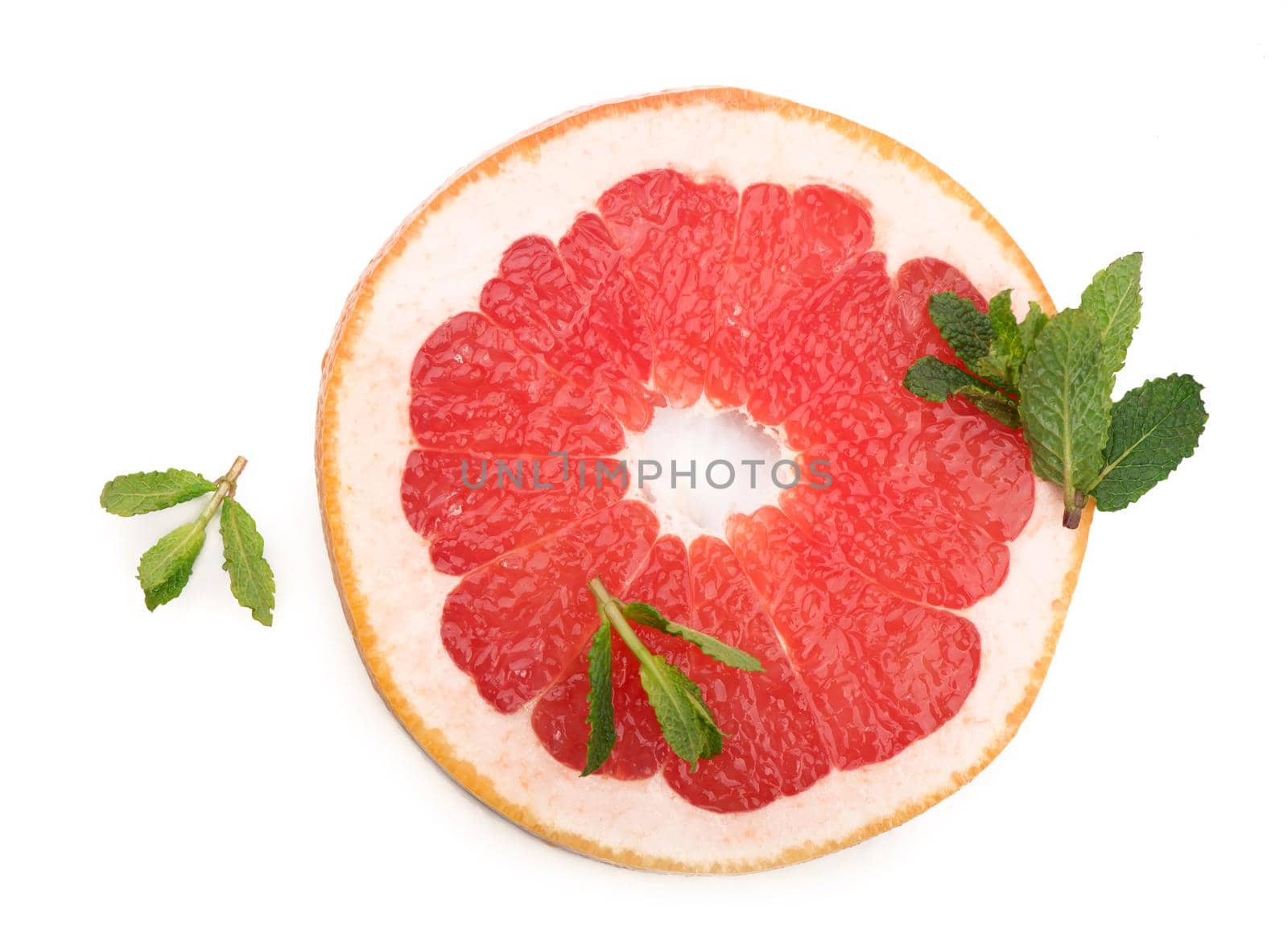 Juicy grapefruit pieces with fresh mint, close up