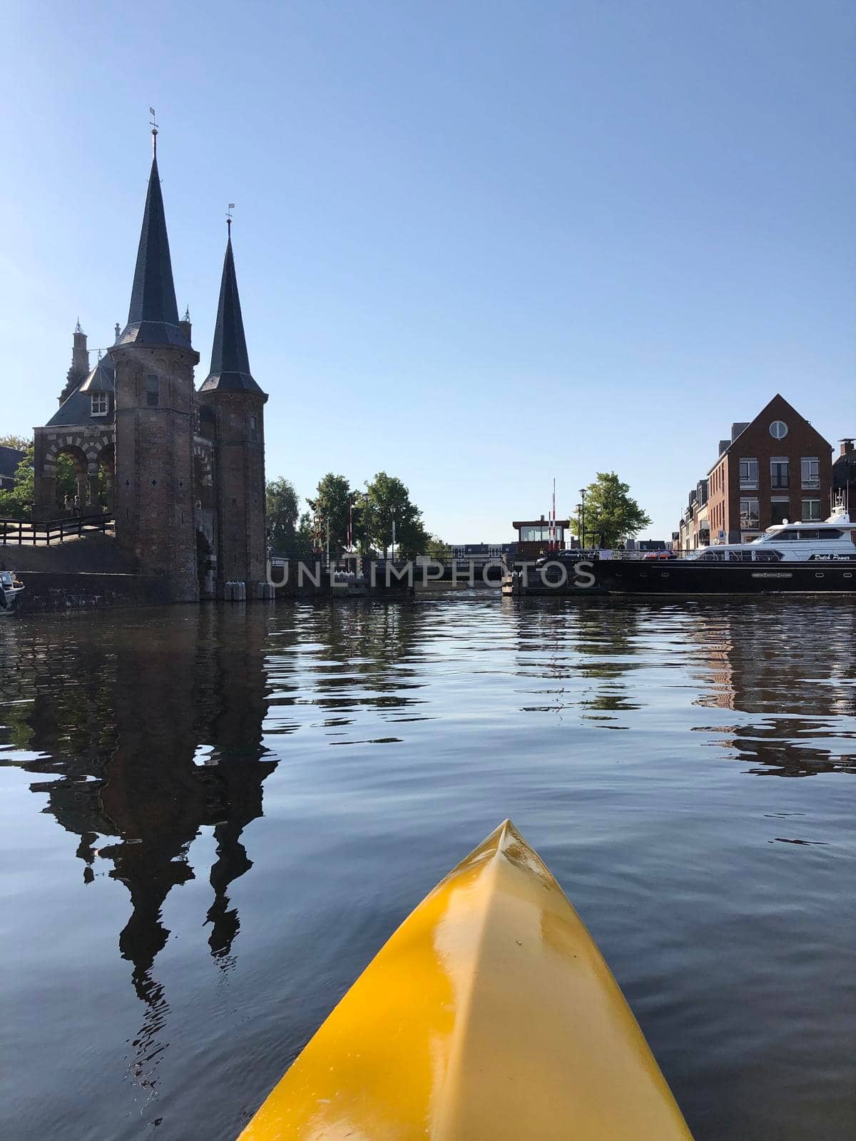 Canoeing towards the waterpoort of Sneek in Friesland The Netherlands