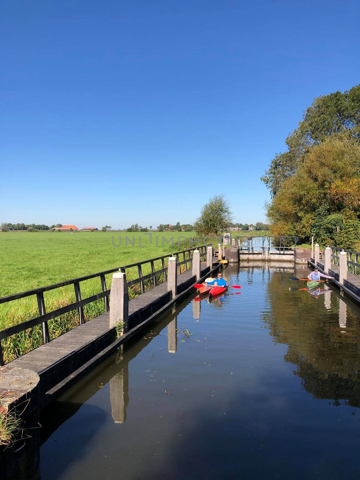 Canal lock with canoes in Friesland The Netherlands