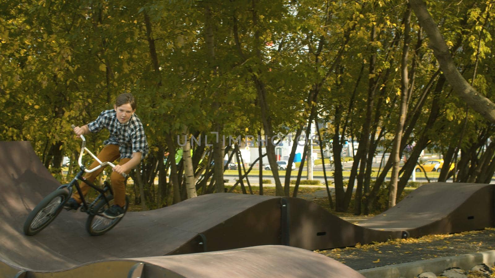 Biker riding on the pump track by Alize