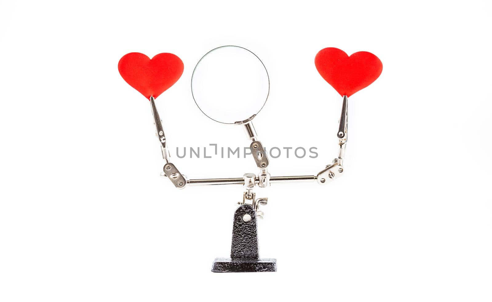 Abstract Valentines Day background with engineering tool third hand holding hearts on white background