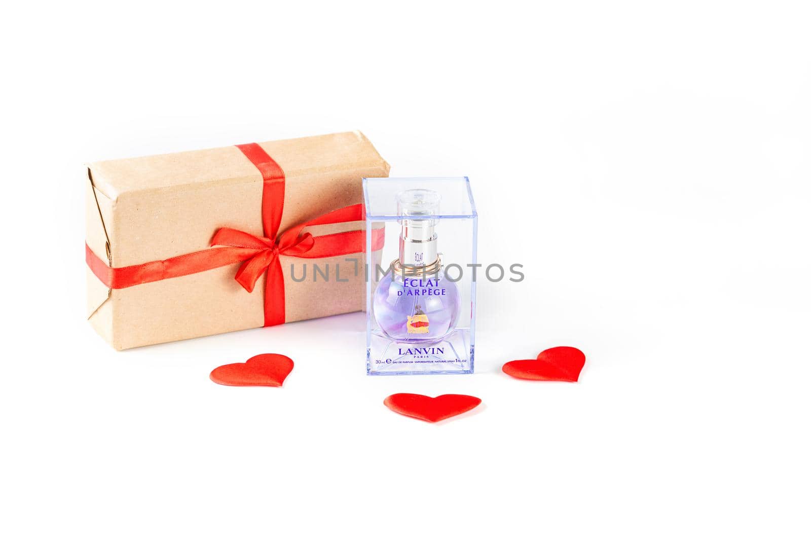 MOSCOW, RUSSIA - JAN 7, 2021: Eclat Lanvin perfume bottle in packaging and valentine's day gift on white background