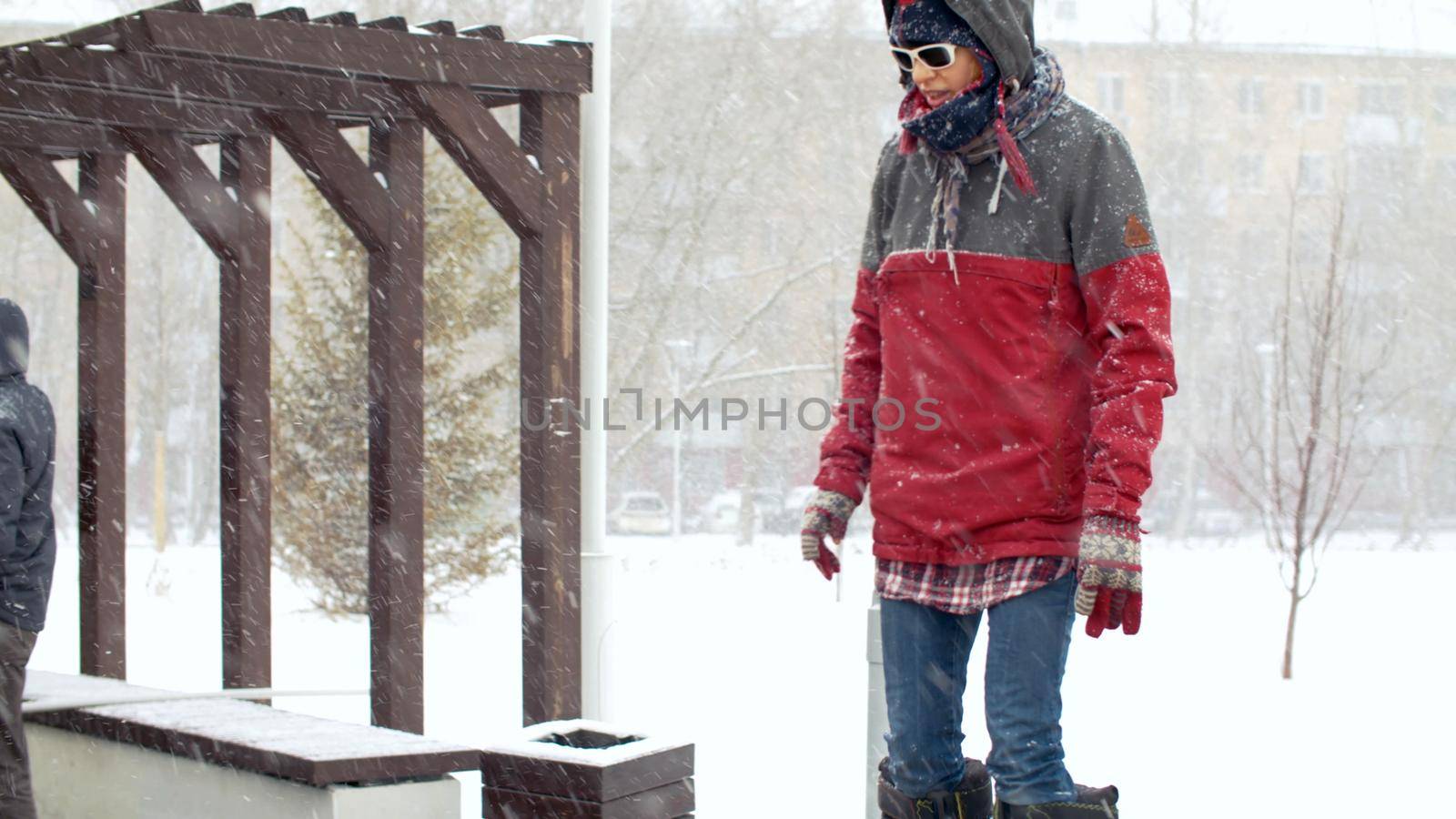 RUSSIA, MOSCOW, march 2020 - girl on stilts under the snowfall at a protest rally against construction. Make Your Voice Heard