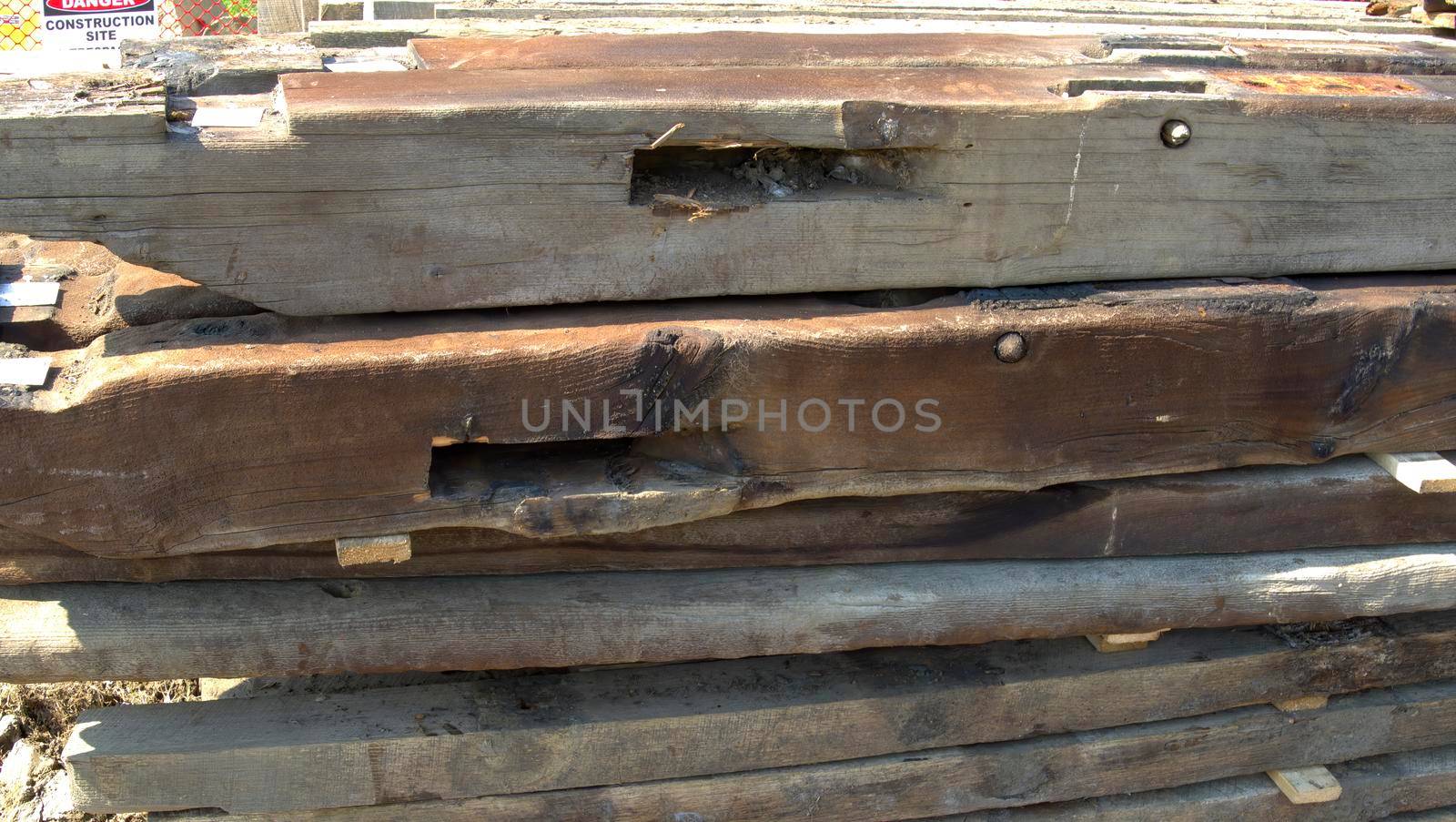 An Old Timber Frame Lumber Being Carefully Laid and Stored for Restoration