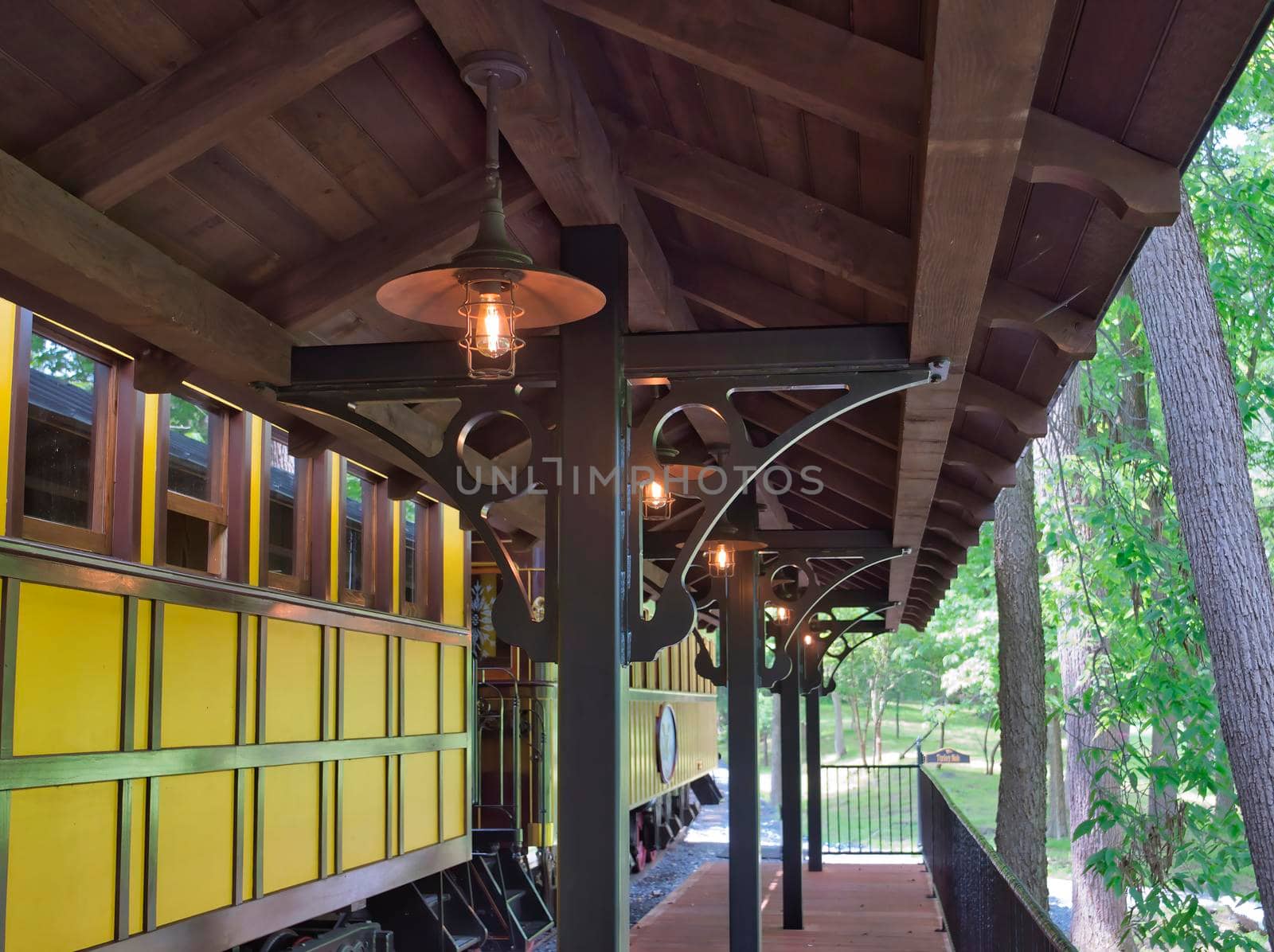 A Train Station Platform with an Antique Passenger Car
