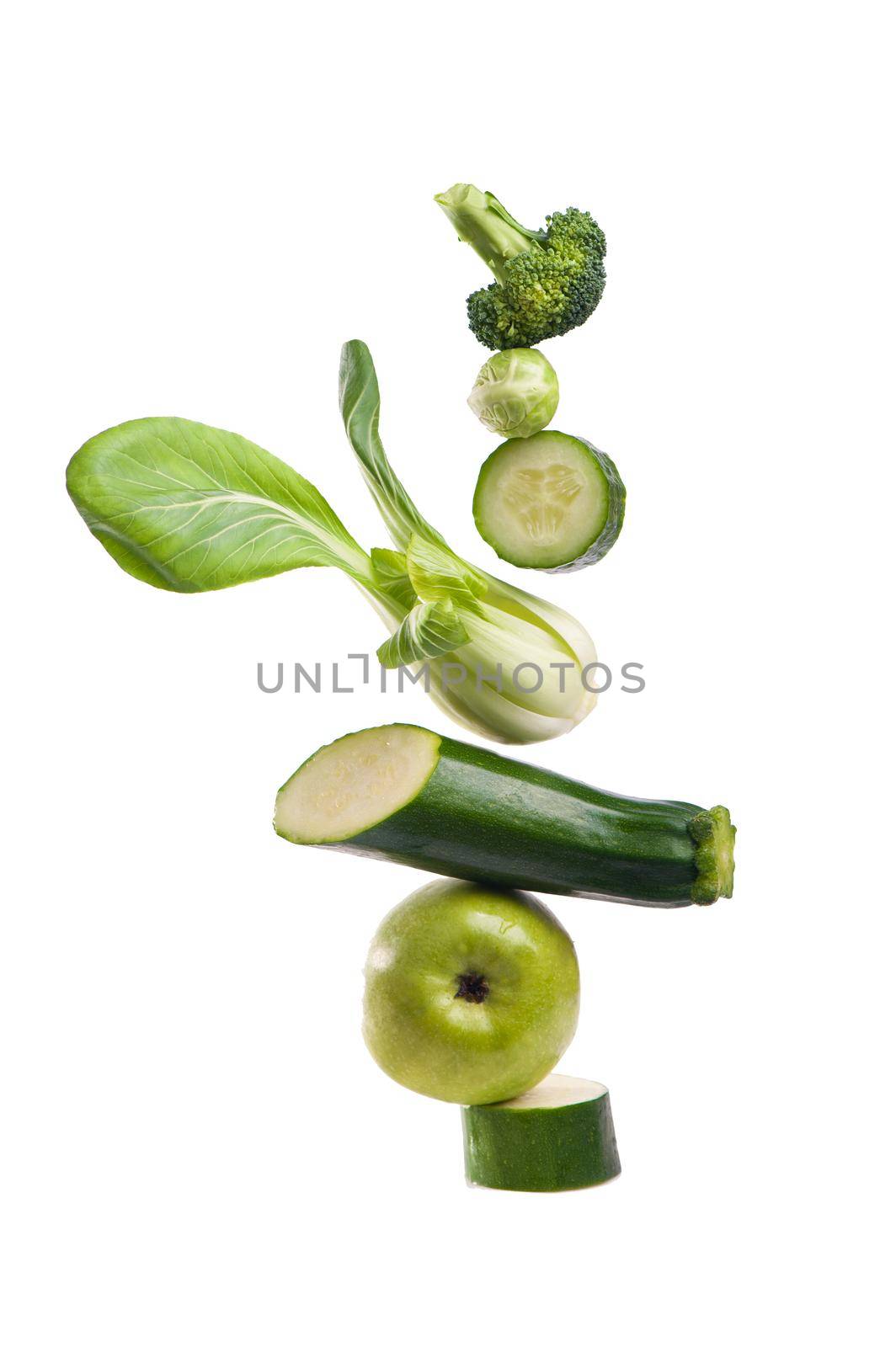 Group of green vegetables on white background by aprilphoto
