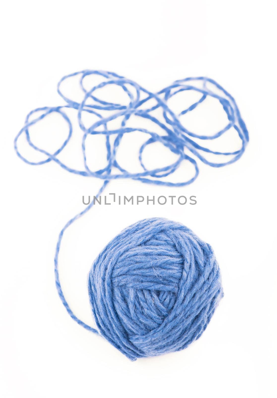 The idea is a tangled thread. Blue ball of yarn on white background