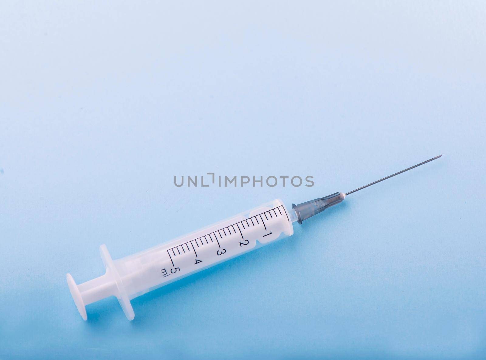 syringe on the table, medical supplies are on the table by aprilphoto