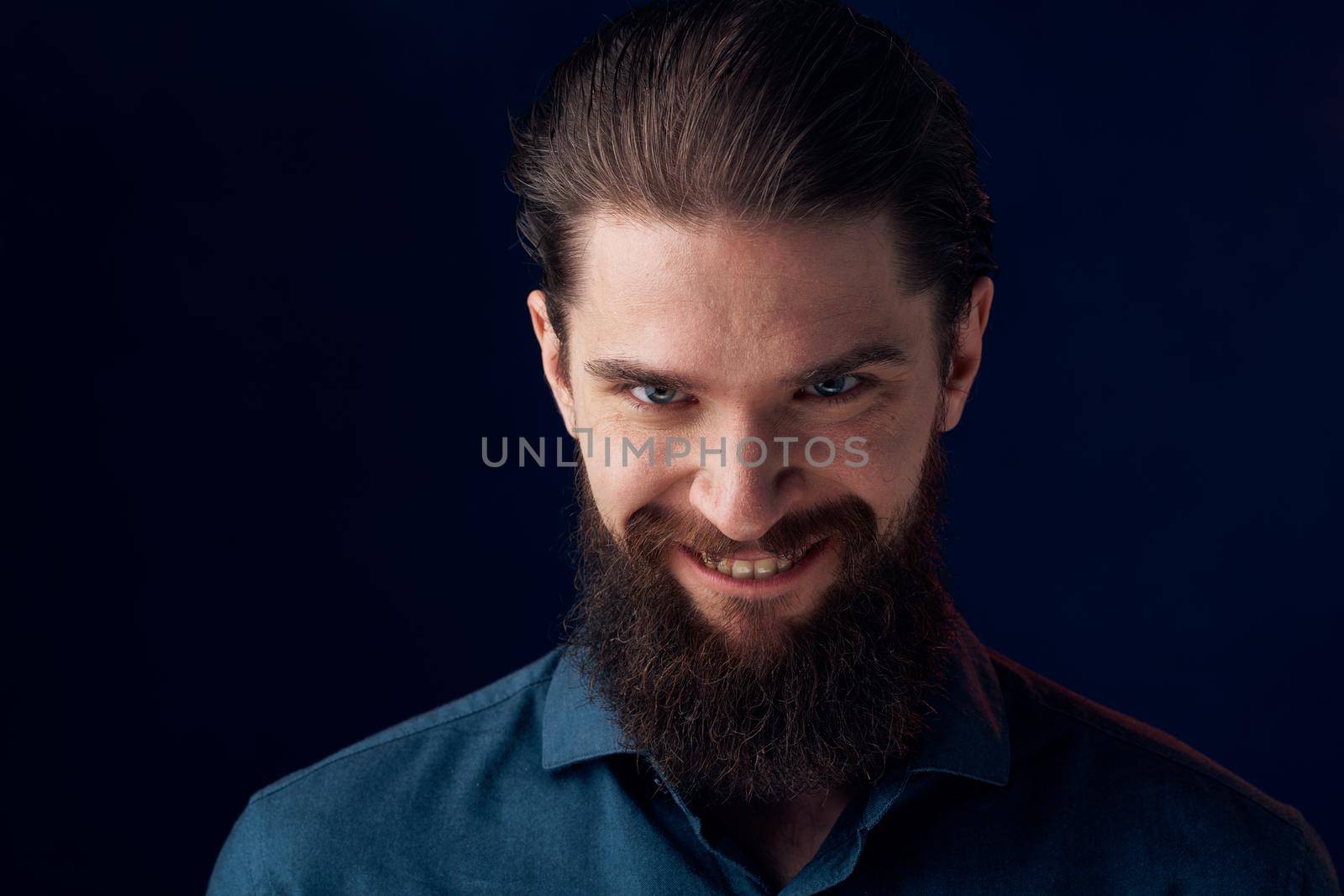 Cheerful man beard emotions black shirt close-up. High quality photo