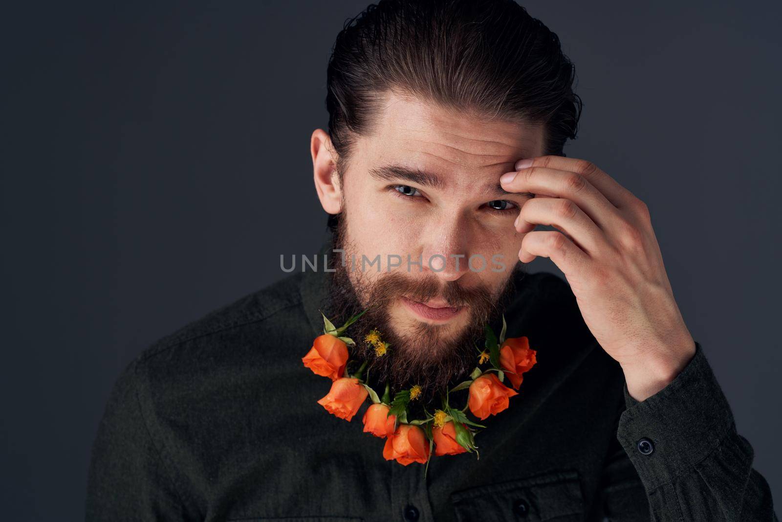 Cute man decorating in the city flowers romance gift. High quality photo
