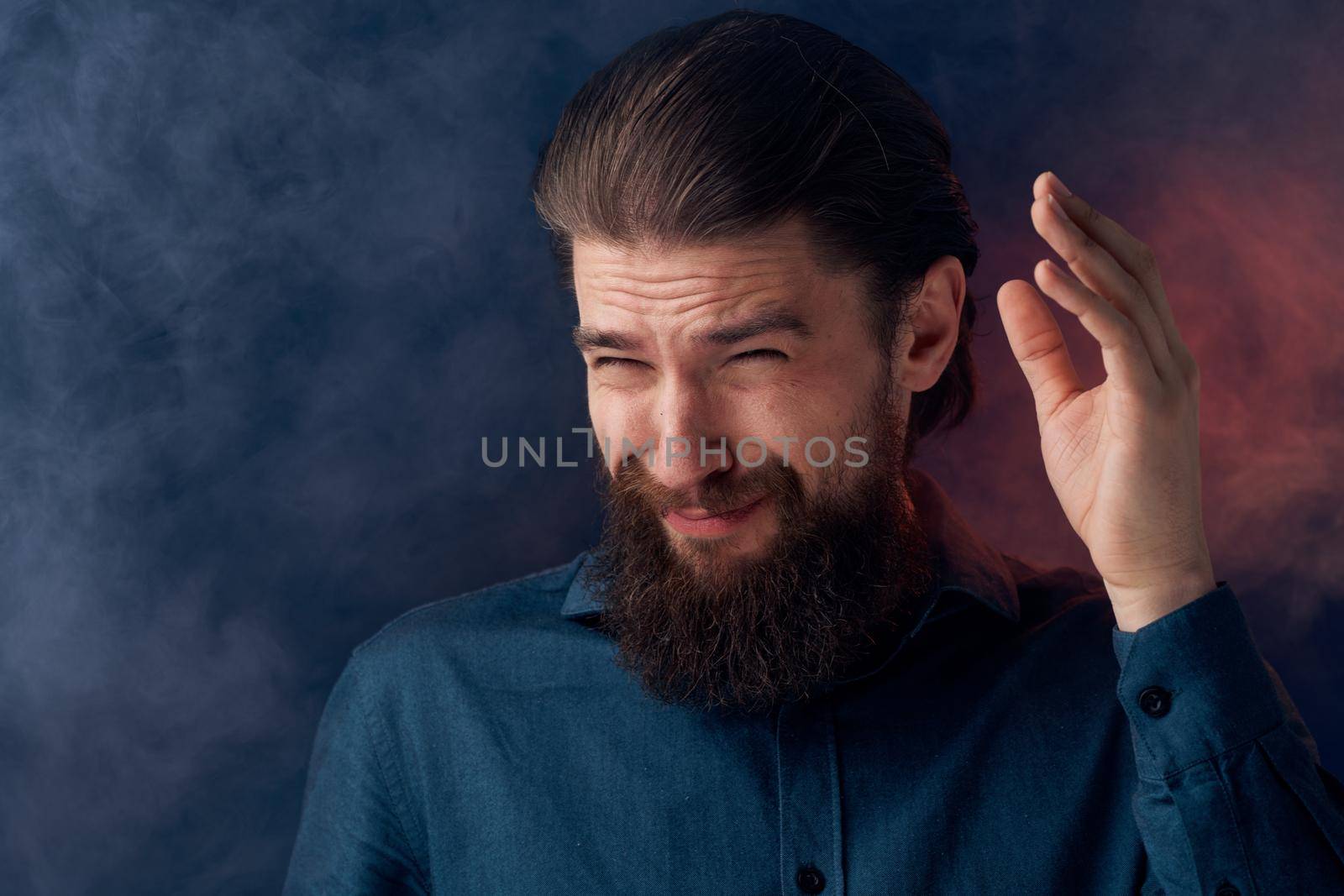 Cheerful man beard emotions black shirt close-up. High quality photo