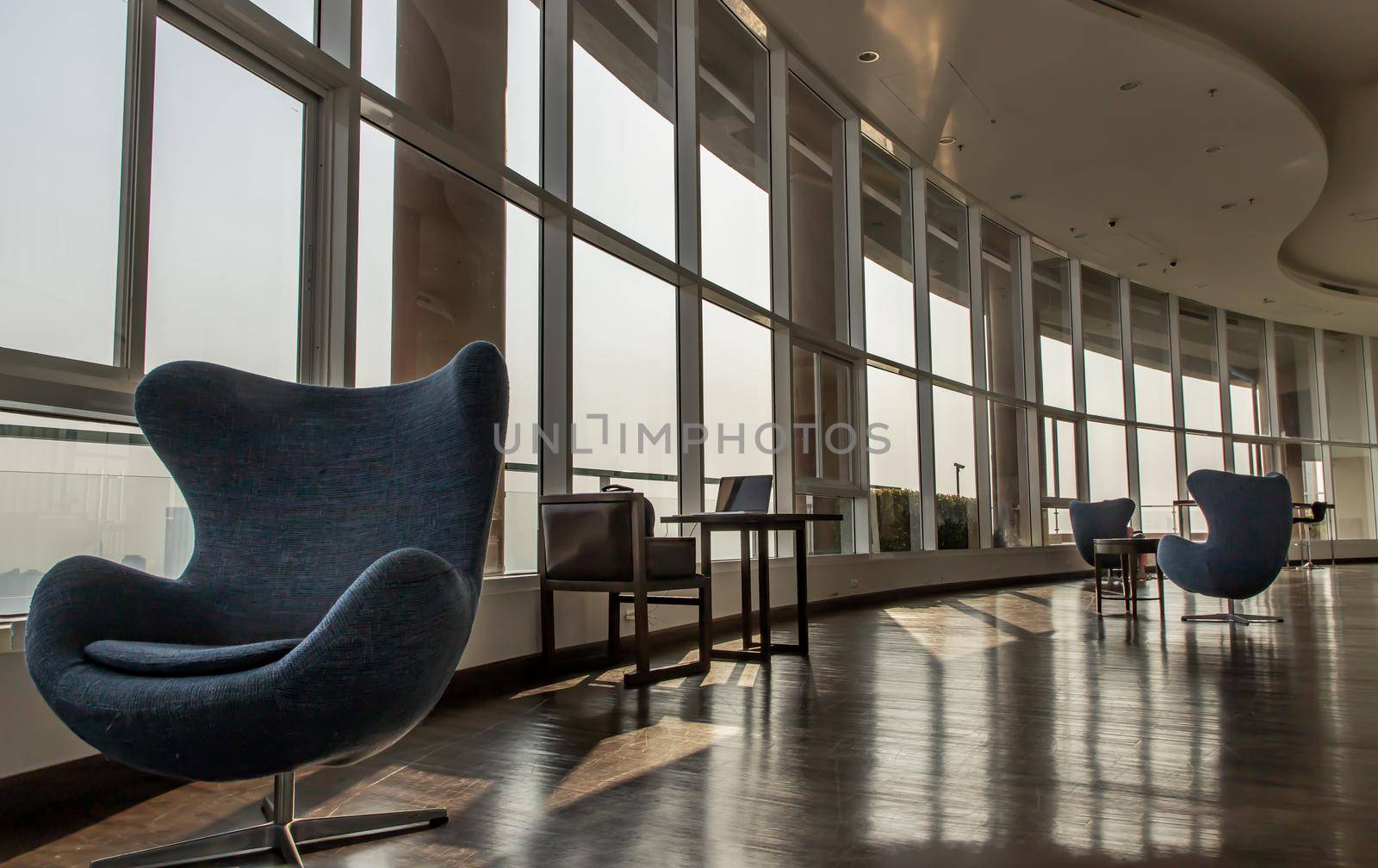 Bangkok, Thailand - Jan 14, 2021 : The new normal for common area in condominium. The seats were set separately according to social distancing policy for the spread of covid-19 prevention. No focus, specifically.