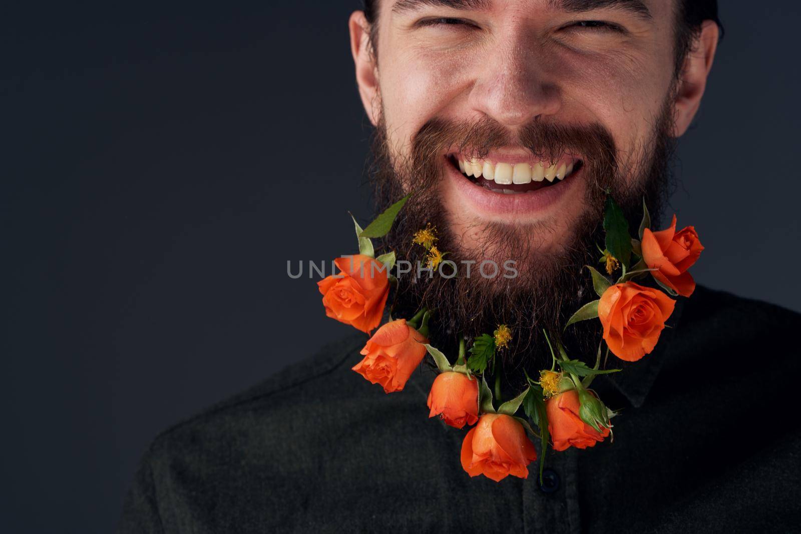 Emotional bearded man flowers romance close-up dark background by SHOTPRIME