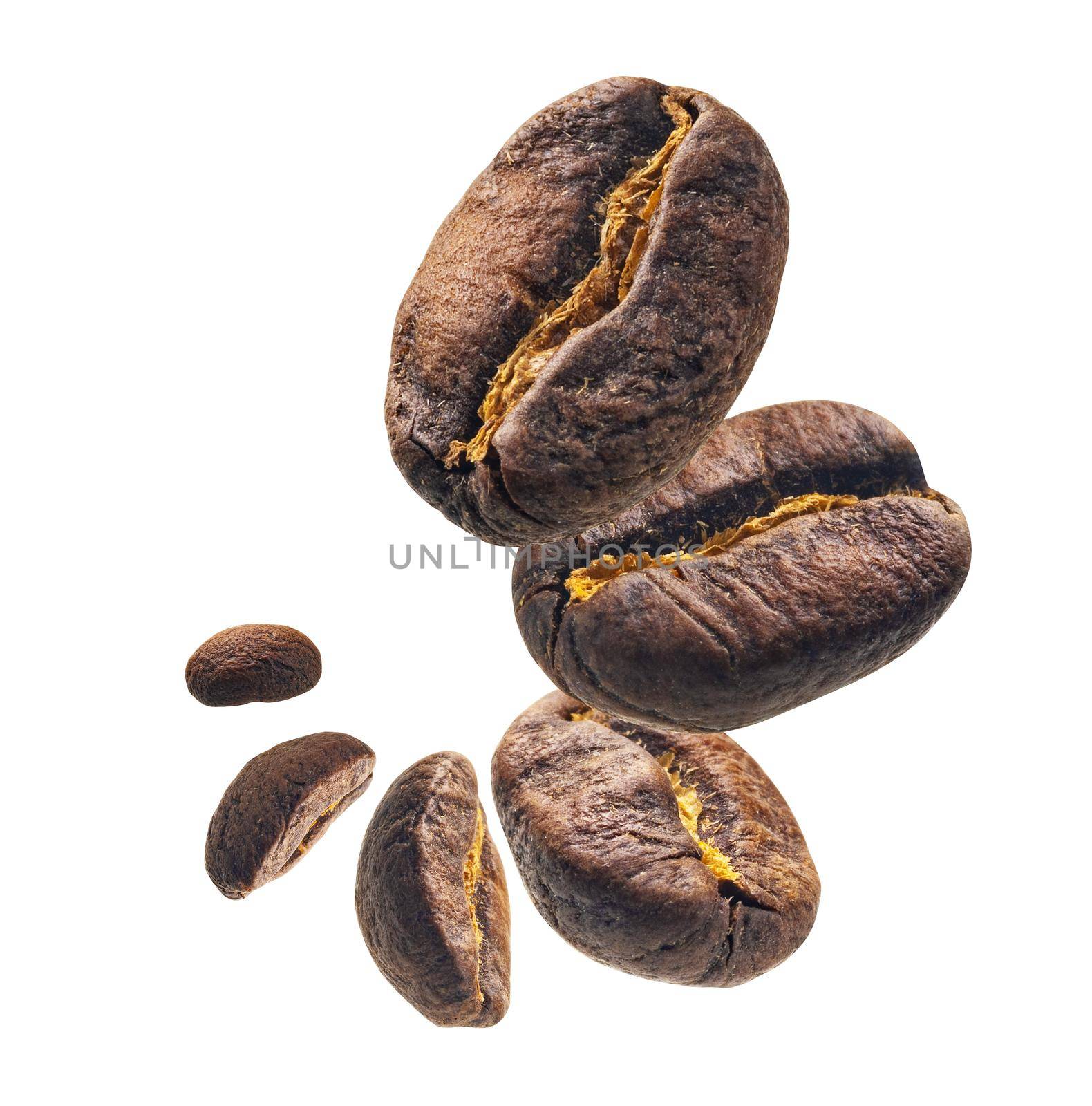 Coffee beans levitate on a white background.