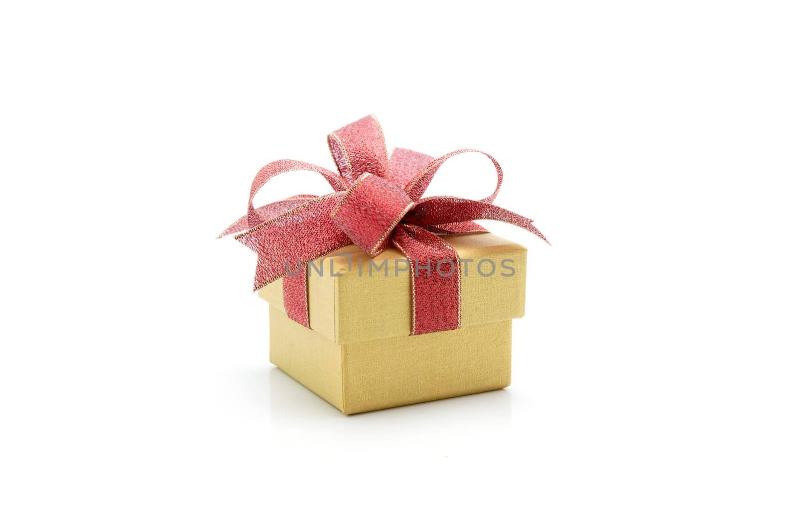 Gold gift box and ribbon isolated on white background, presents in valentine day or Christmas day, object in birthday or anniversary, package with wrap luxury, holiday and festive concept. by nnudoo
