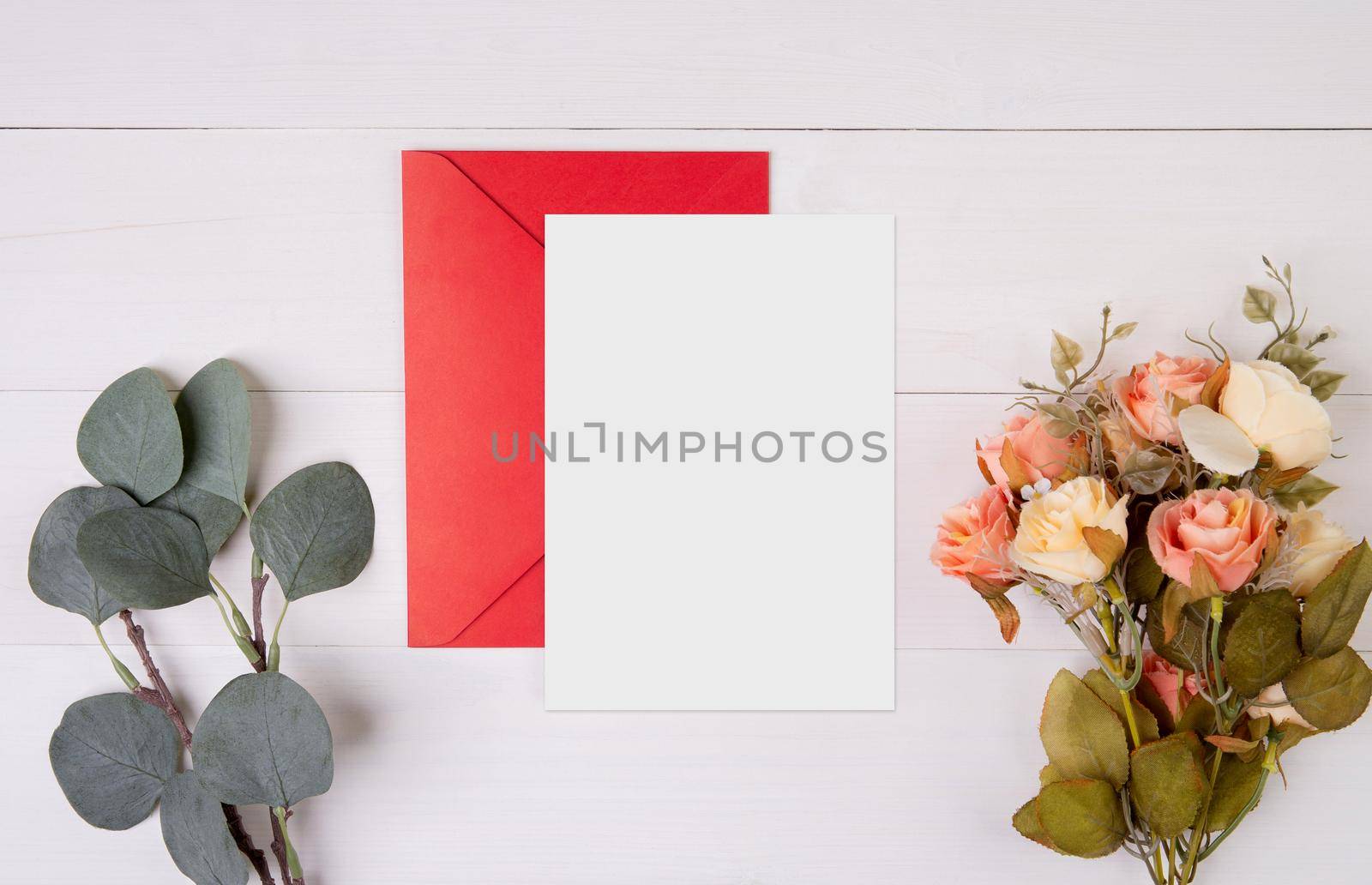 Valentine day, greeting card mockup and letter and flower on wooden table, postcard blank and letter with romance on desk, present in anniversary and celebration, top view, holiday concept.