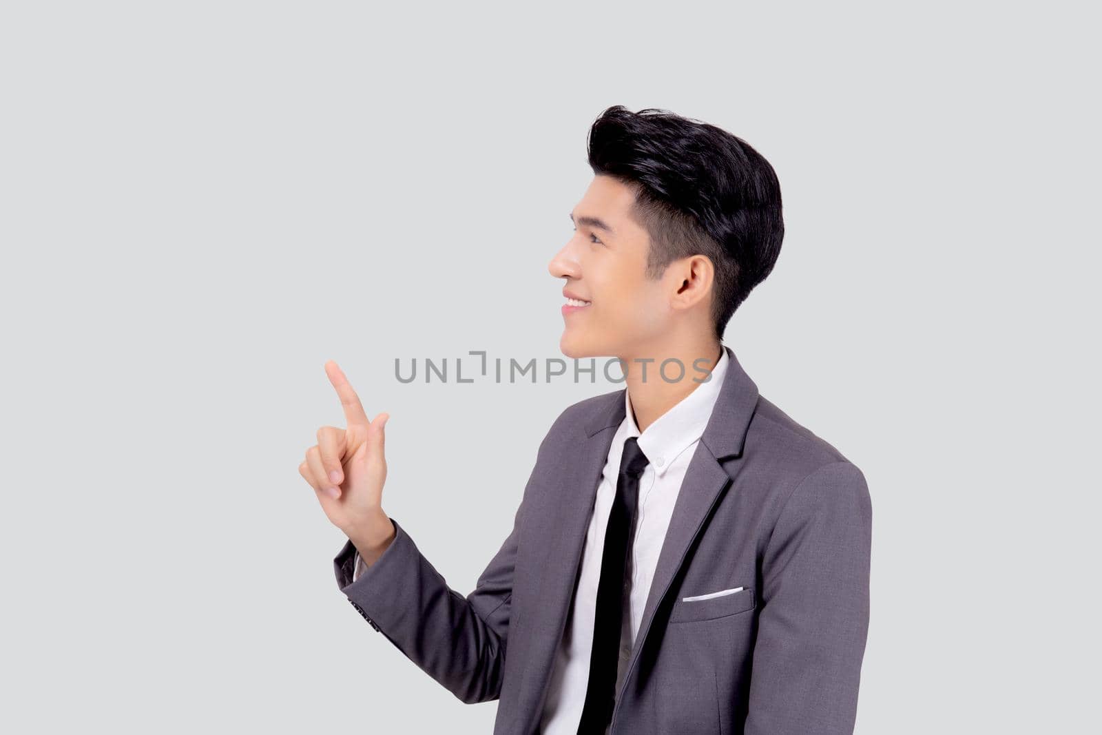 Portrait young asian business man pointing and presenting isolated on white background, advertising and marketing, executive and manager, male confident showing success, expression and emotion.