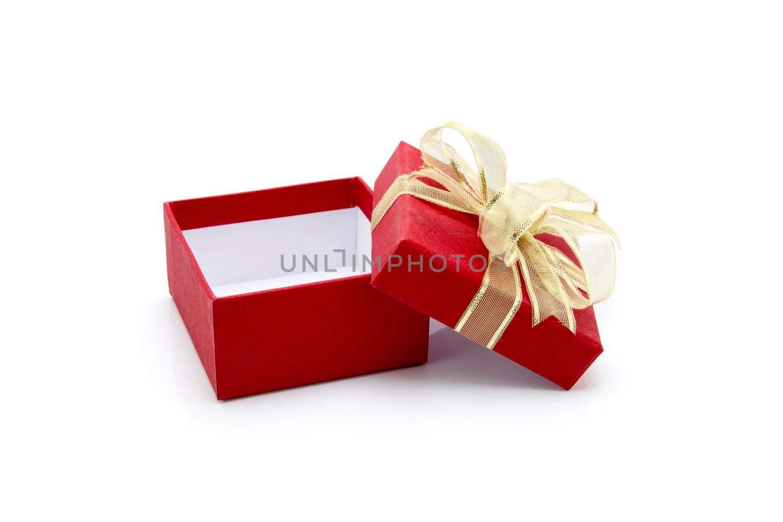 Red gift box and ribbon open isolated on white background, presents in valentine day or Christmas day, object in birthday or anniversary, package with wrap luxury, nobody, holiday and festive concept. by nnudoo