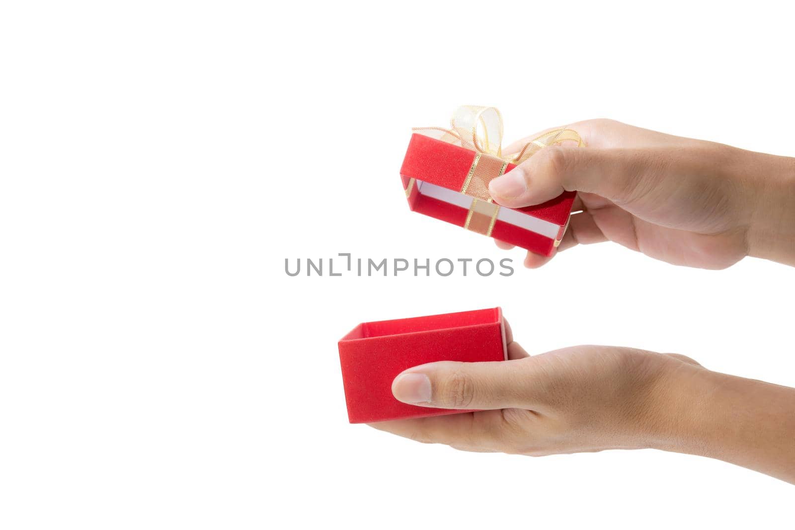 Hand open red gift box with lid isolated on white background, hand giving presents of birthday for surprise in anniversary, romance and love, feeling happy, Valentine or Christmas day concept.