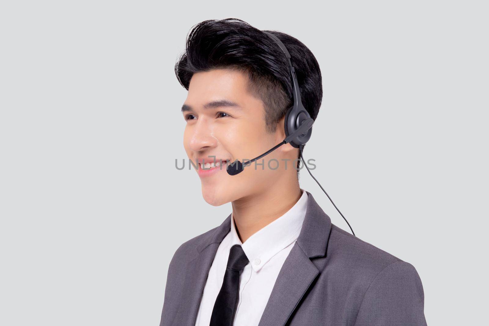 Portrait young asian business man call center wearing headset isolated on white background, agent with support and service, businessman is assistant for client with phone or helpline online.