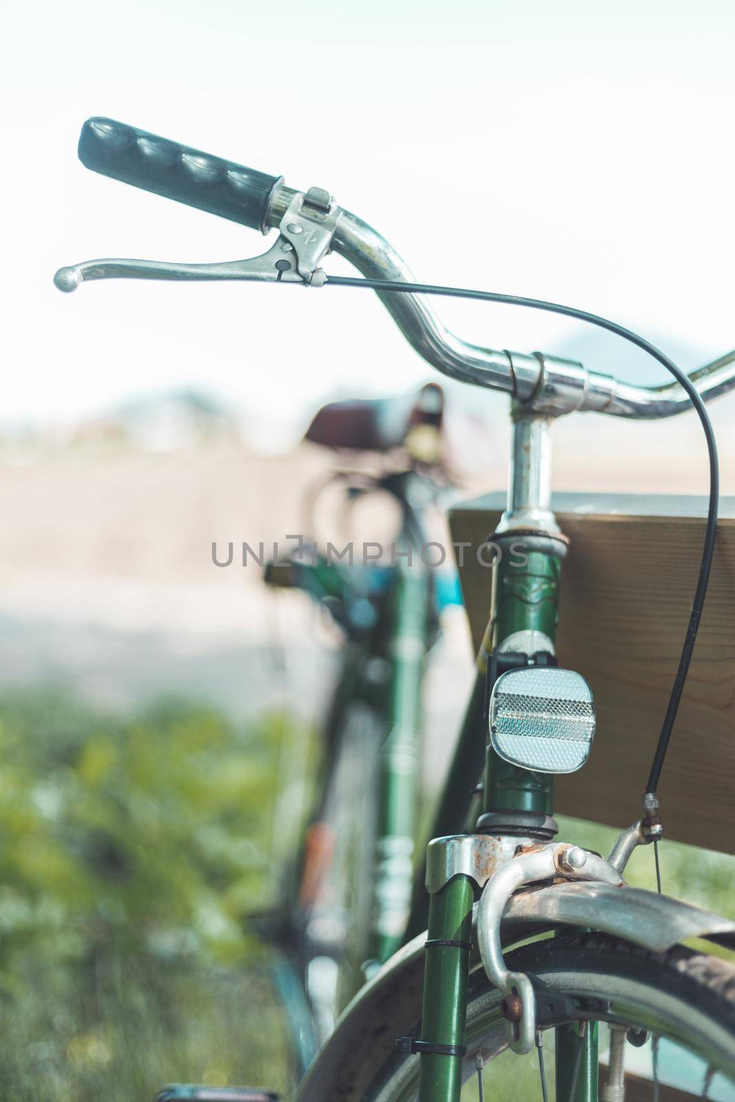 Front picture of a vintage retro bike, head reflectors and blurry background