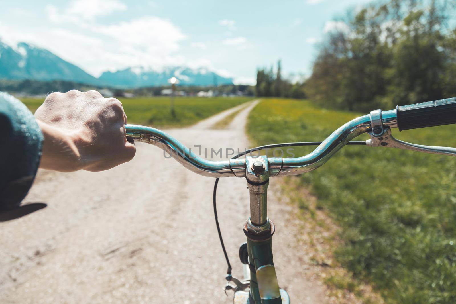 Closeup picture of a vintage bicycle handlebar and breaks outdoors, blurred background