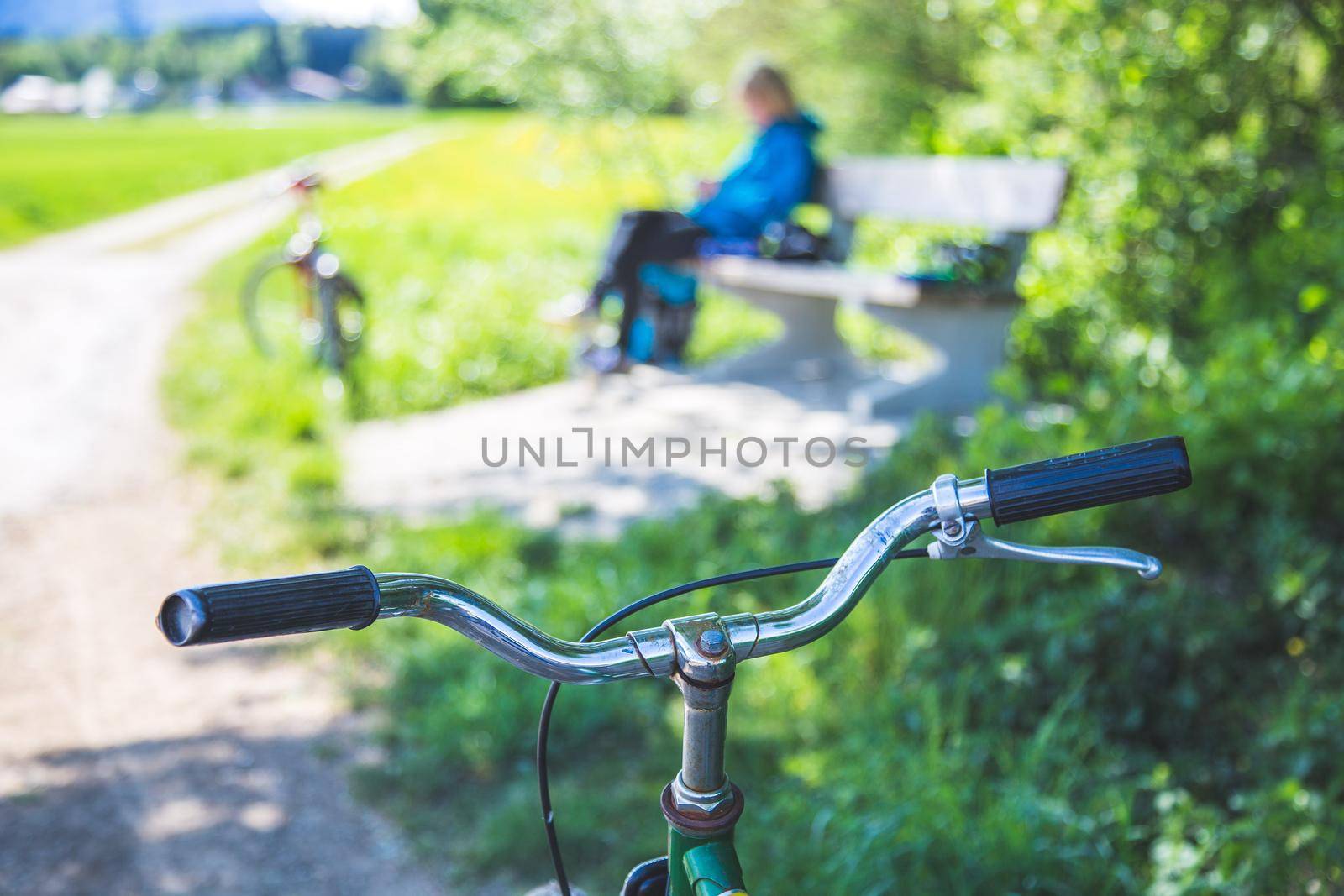 Closeup picture of a vintage bicycle handlebar and breaks outdoors, blurred background