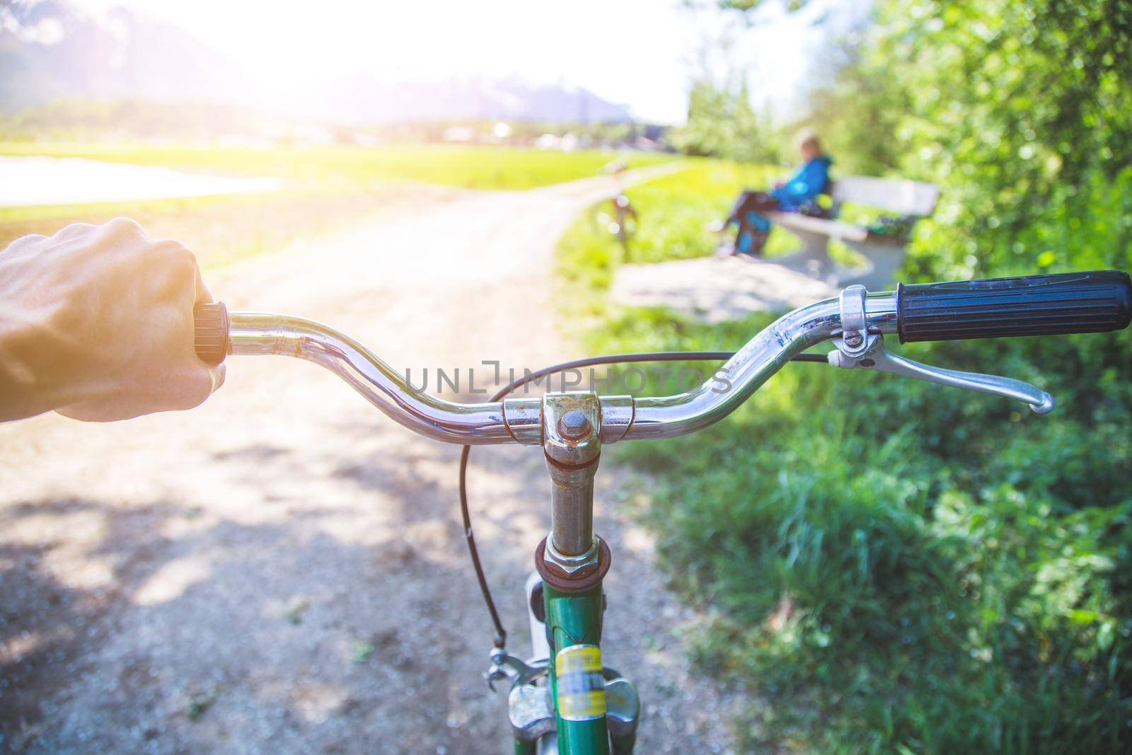 Closeup picture of a vintage bicycle handlebar and breaks outdoors, blurred background
