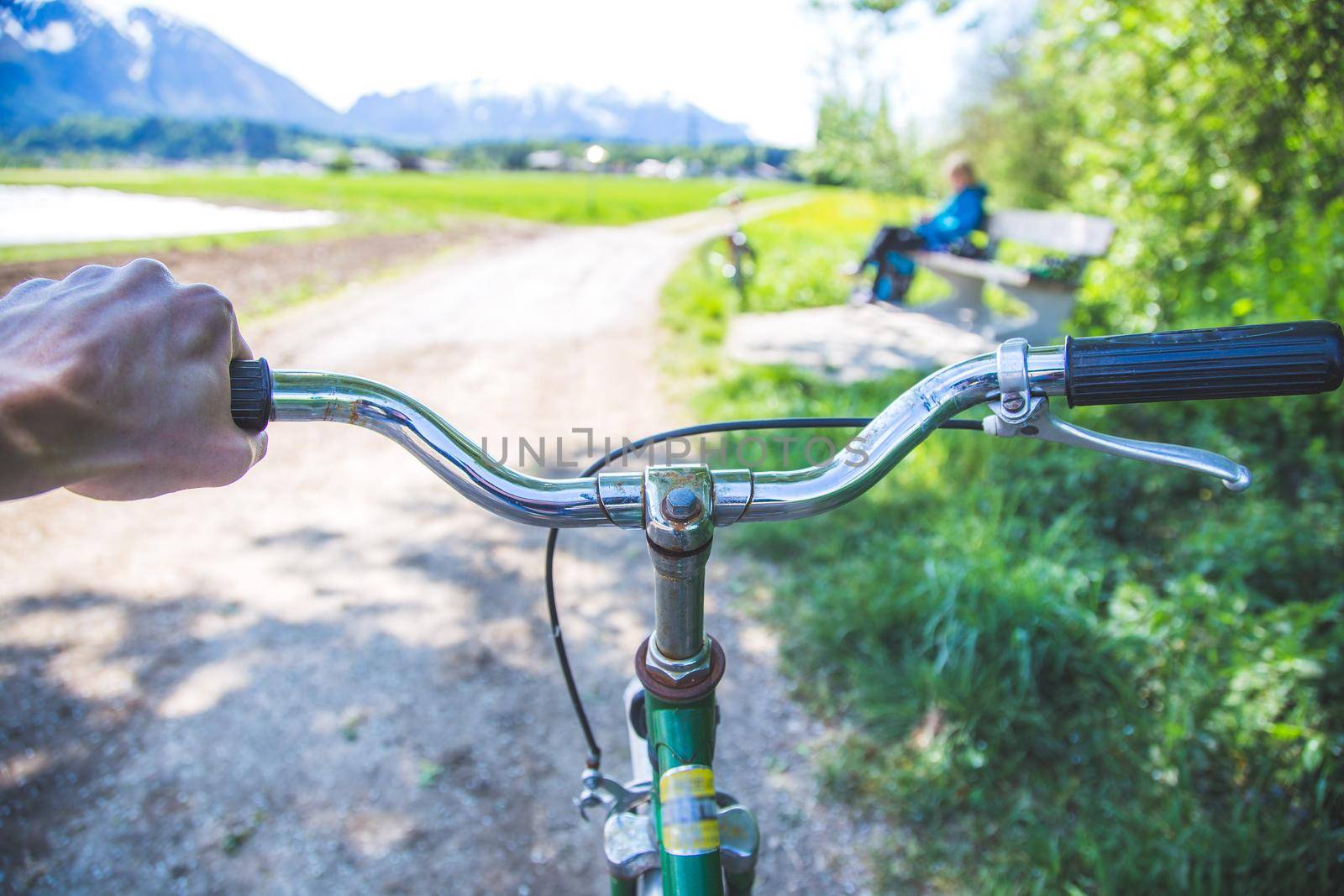Closeup picture of a vintage bicycle handlebar and breaks outdoors, blurred background