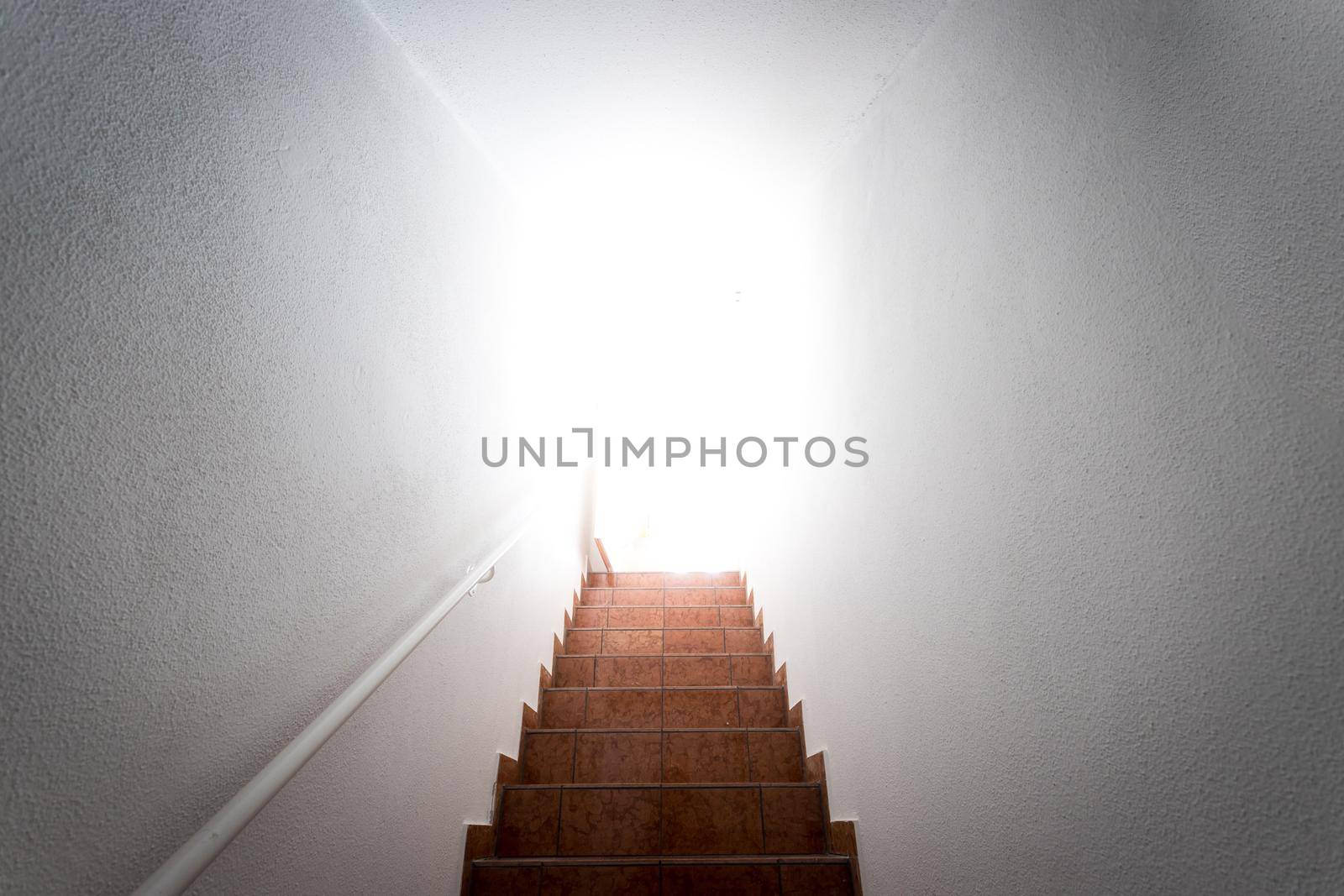Basement stairs with balustrade. Natural bright sunlight.