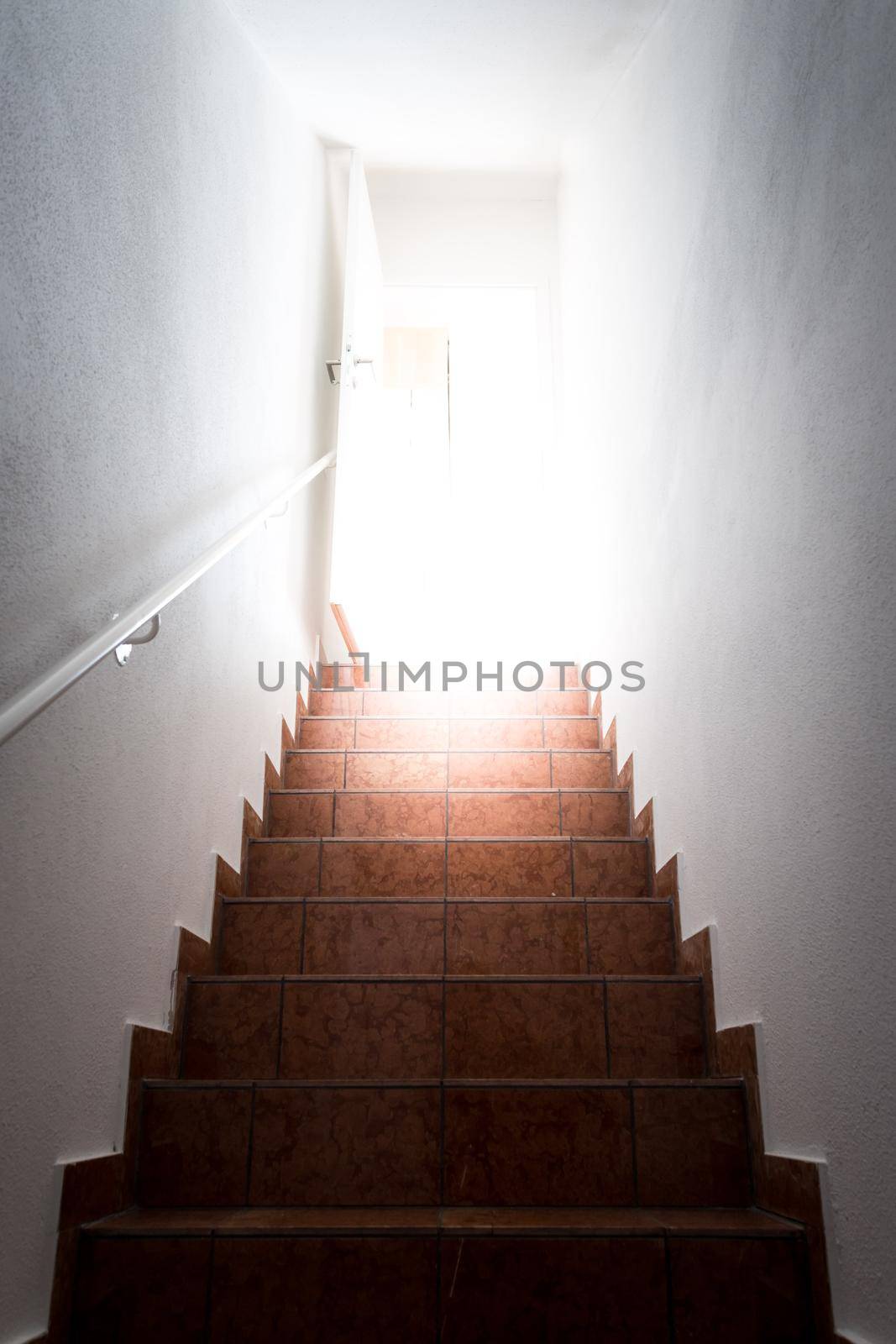 Basement stairs with balustrade. Natural bright sunlight.