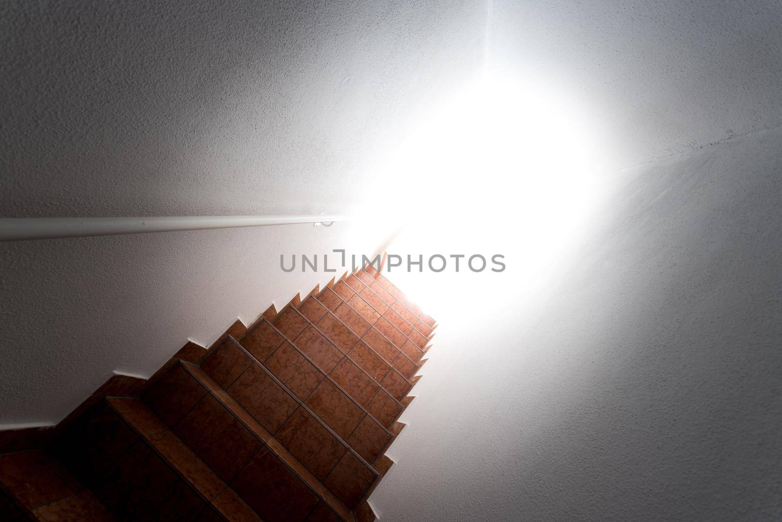 Basement stairs with balustrade. Natural bright sunlight.