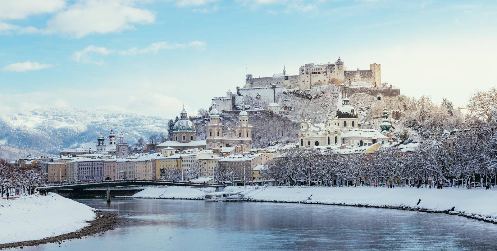 Panorama of Salzburg in winter: Snowy historical center, sunshine