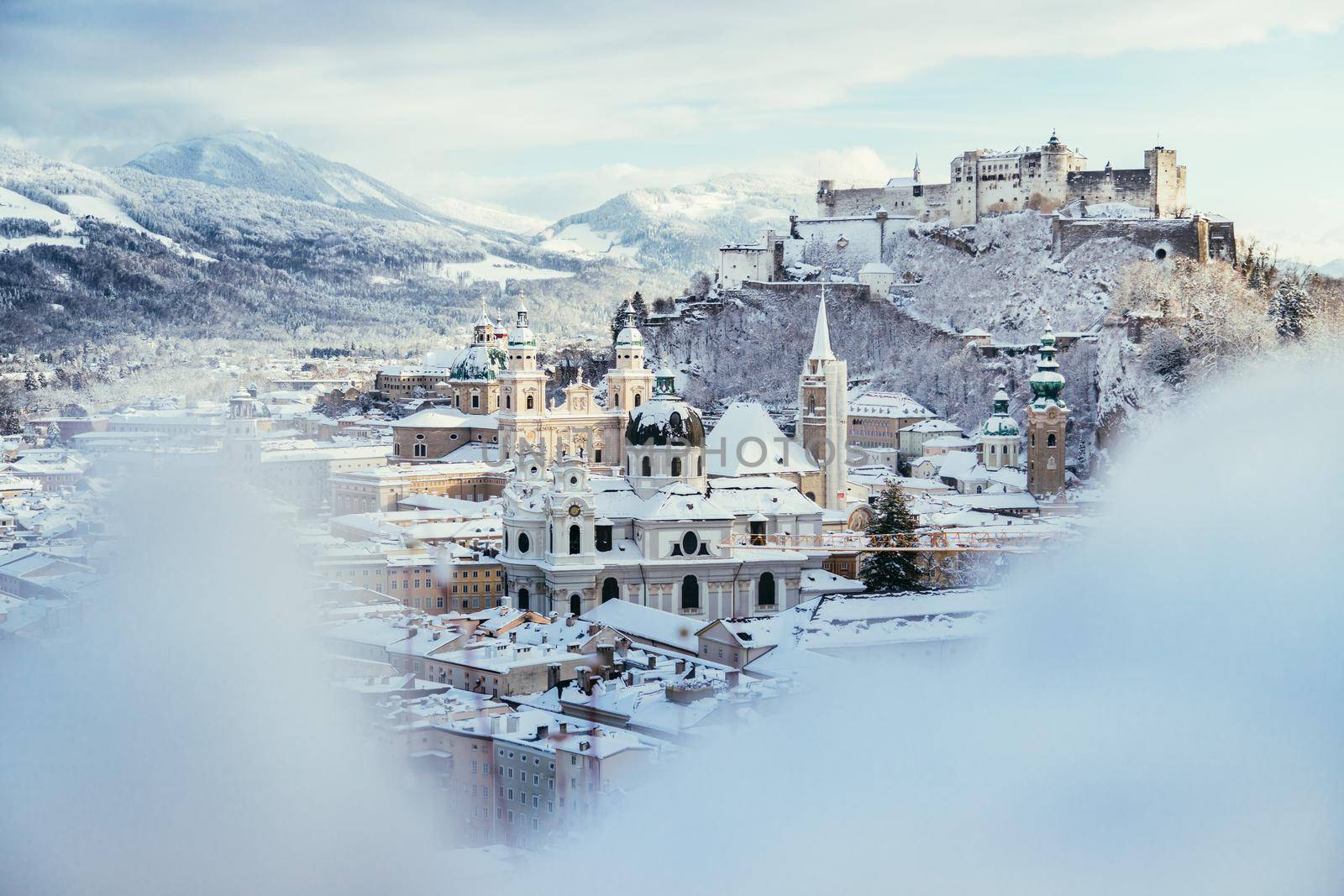 Panorama of Salzburg in winter: Snowy historical center, sunshine