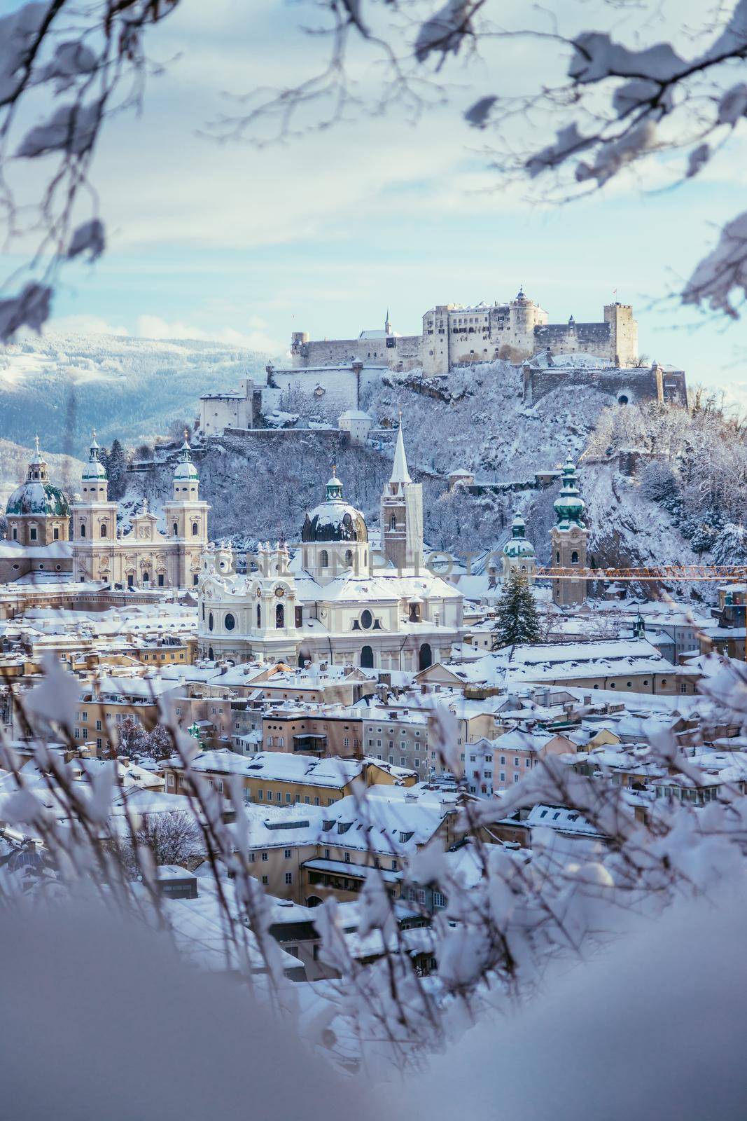 Panorama of Salzburg in winter: Snowy historical center, sunshine