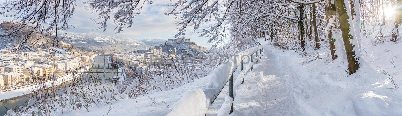 Walking promenade in Salzburg, snowy winter landscape