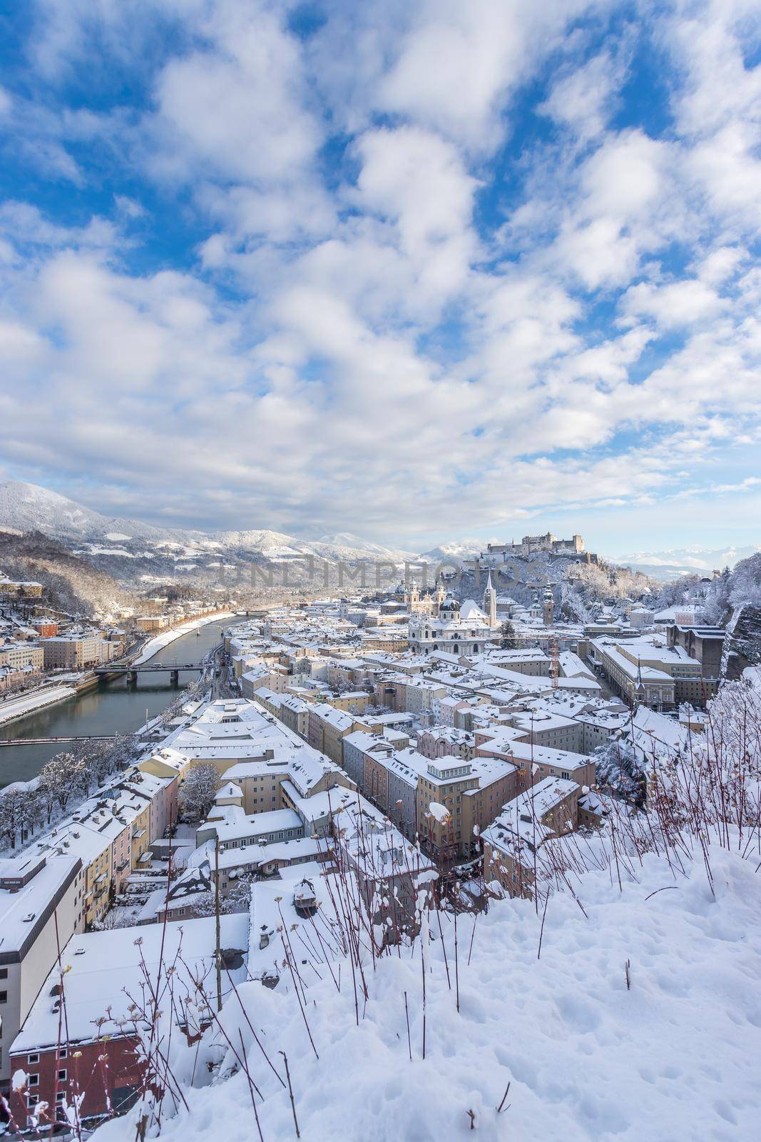 Panorama of Salzburg in winter: Snowy historical center, sunshine by Daxenbichler