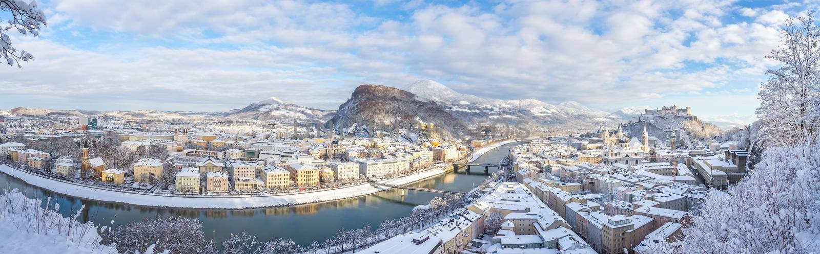 Panorama of Salzburg in winter: Snowy historical center, sunshine