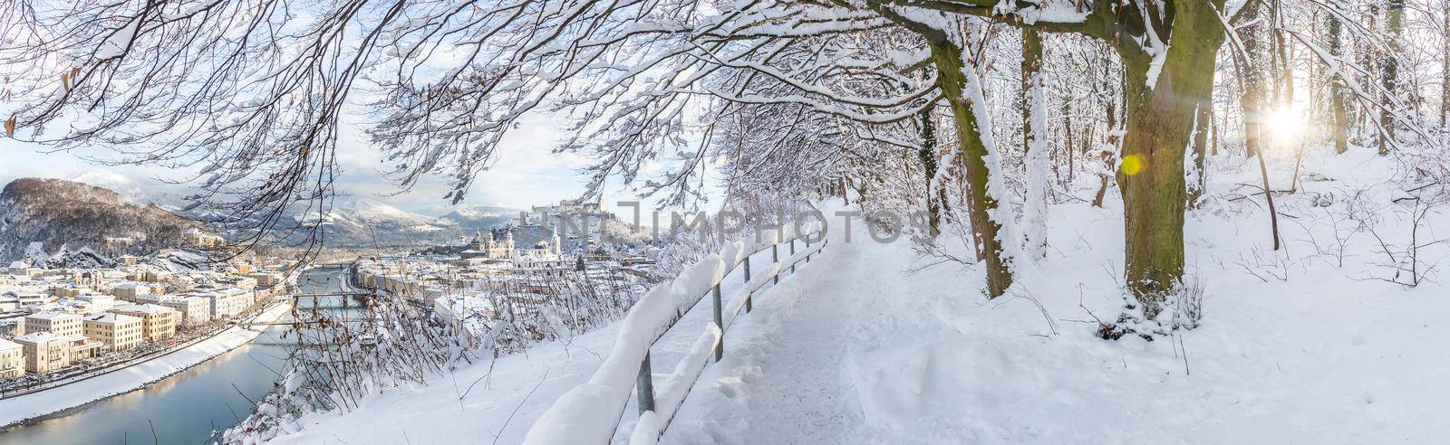 Walking promenade in Salzburg, snowy winter landscape
