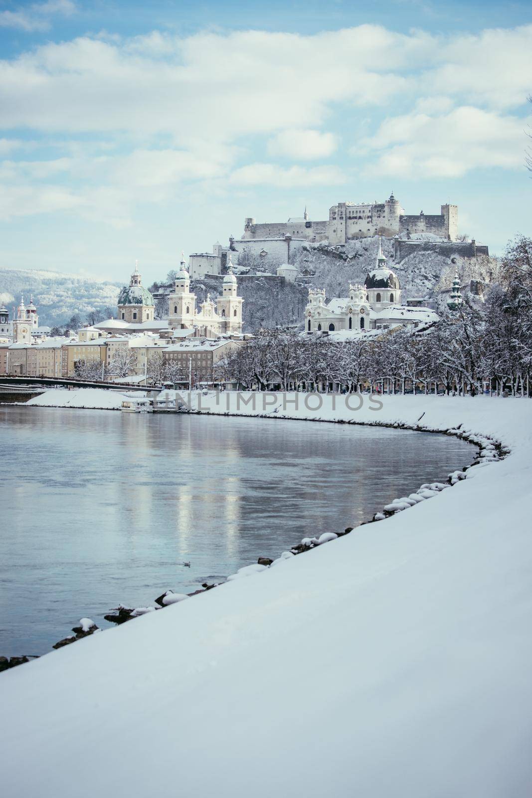 Panorama of Salzburg in winter: Snowy historical center, sunshine