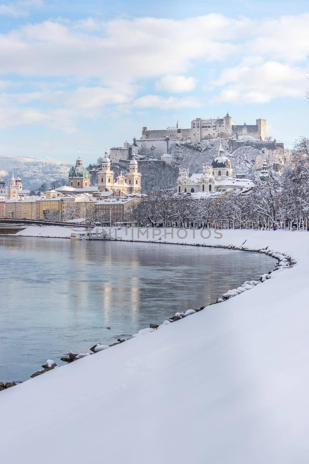 Panorama of Salzburg in winter: Snowy historical center, sunshine