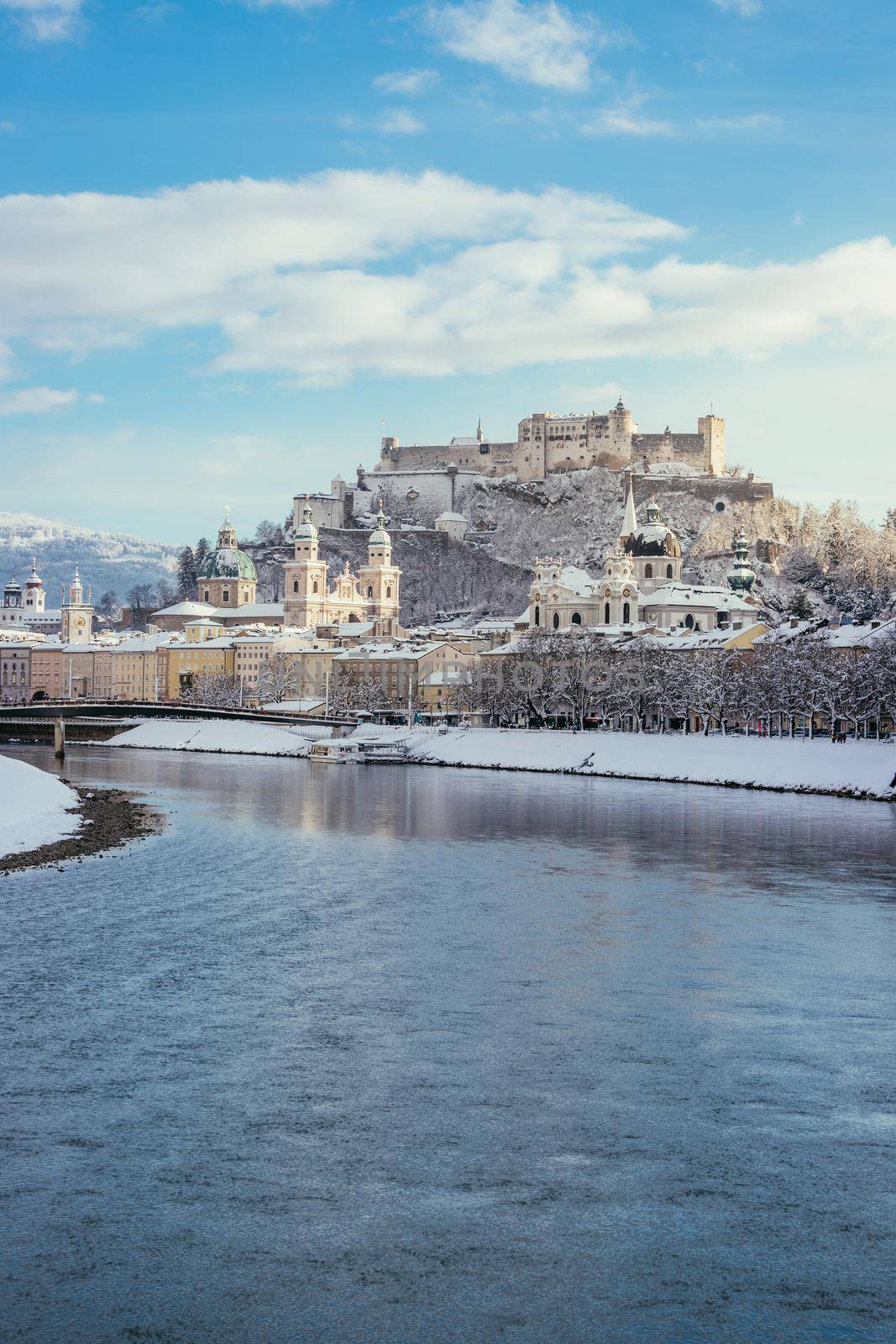 Panorama of Salzburg in winter: Snowy historical center, sunshine