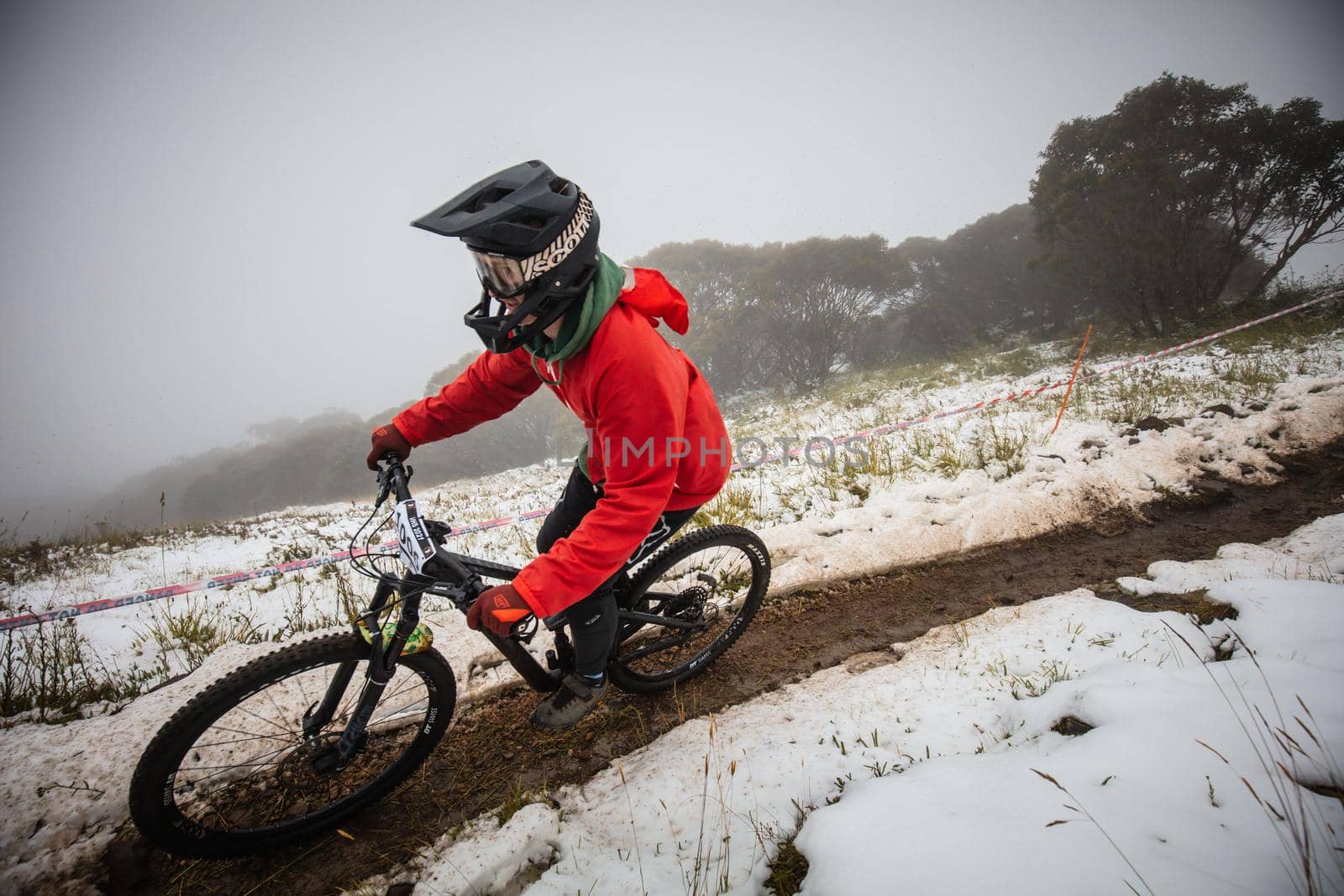Mt Buller, Australia - January 16 2021: Practice round for the Victorian Downhill Mountain Bike Series after a summer snow storm