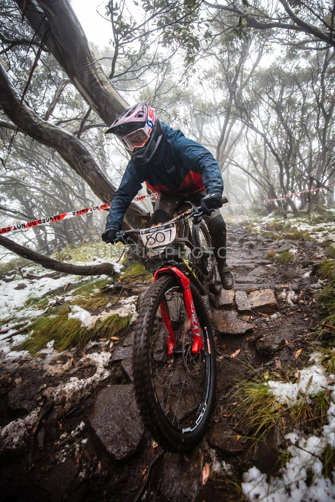 Mt Buller, Australia - January 16 2021: Practice round for the Victorian Downhill Mountain Bike Series after a summer snow storm