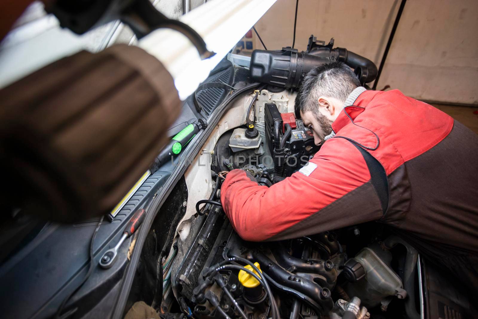 Mechanic at work on the engine 4 by pippocarlot