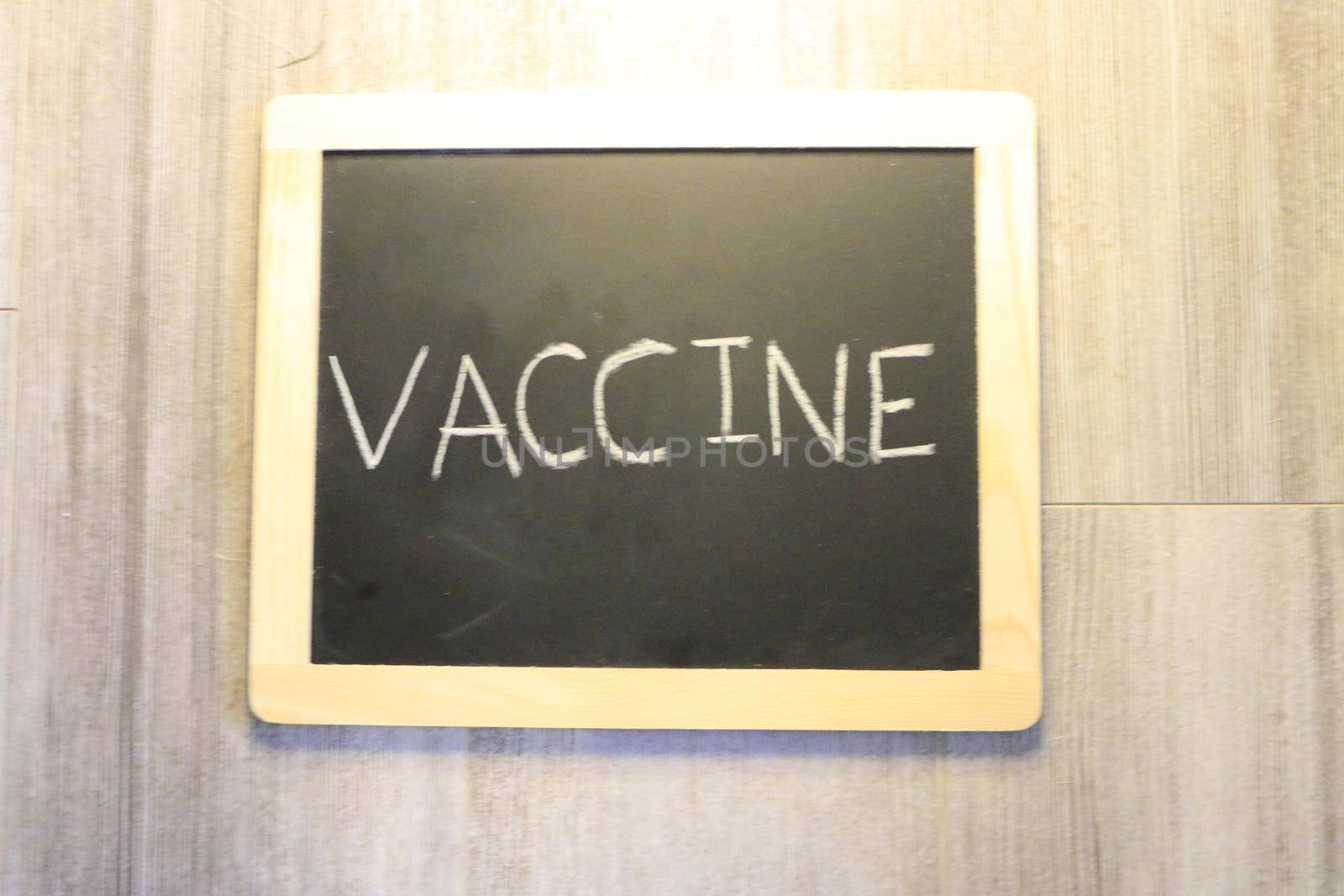 vaccine themed images with the word vaccine on a blackboard by mynewturtle1