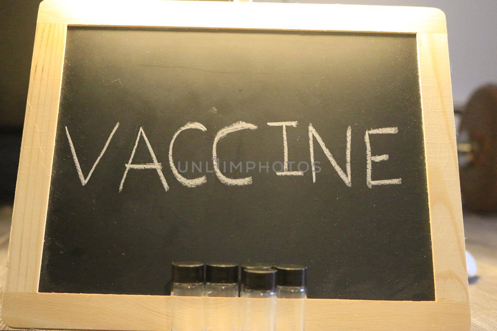 vaccine themed images with the word vaccine on a blackboard by mynewturtle1