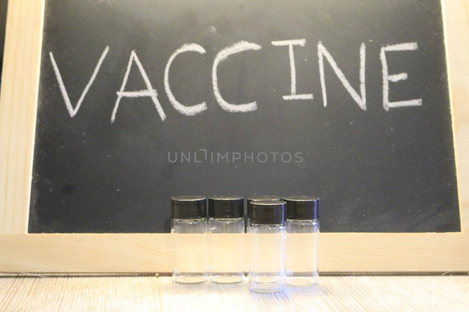 vaccine themed images with the word vaccine on a blackboard by mynewturtle1